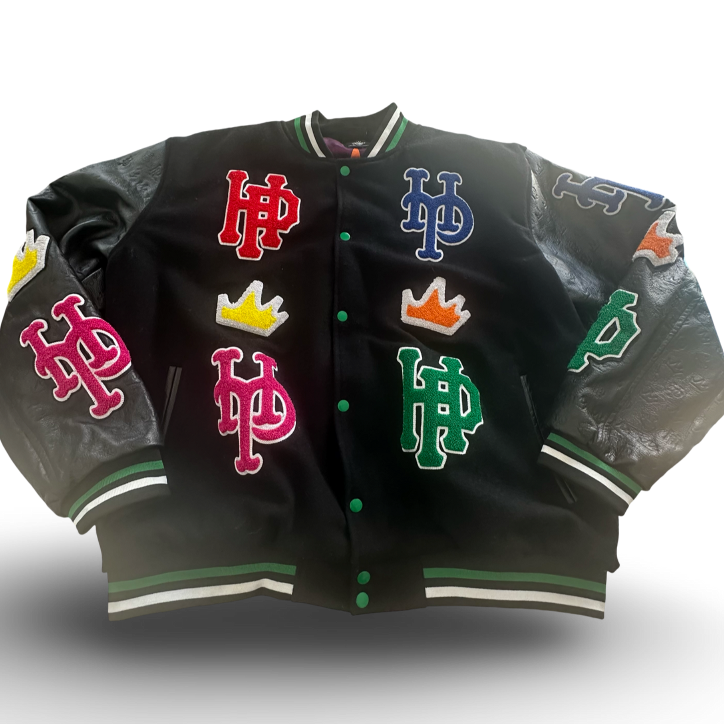 Black varsity jacket with colorful logos on a white background